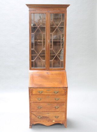 An Edwardian mahogany bureau bookcase, the upper section with moulded and dentil cornice, the interior fitted shelves enclosed by astragal glazed panelled doors, the base with fall front revealing a stepped interior above 4 long drawers, raised on splayed bracket feet 200cm h x 63cm w x 46cm d  