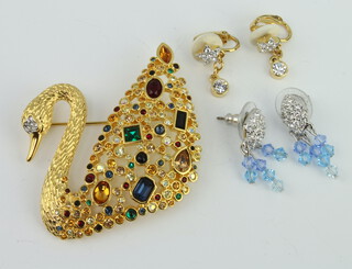 A Swarovski Crystal swan brooch together with 2 pairs of earrings 