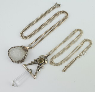 Two silver mounted hardstone pendants and chains