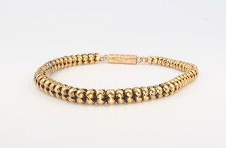 A 9ct yellow gold tapered bead bracelet 20cm, 9.6 grams