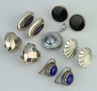 Five pairs of silver earrings