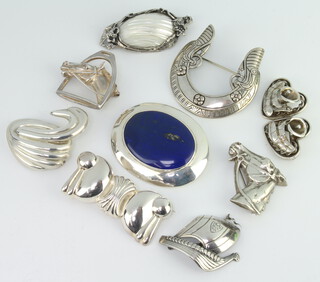 Nine silver mounted brooches, gross weight 140 grams
