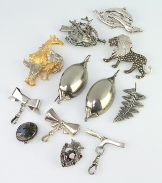 A cast silver gilt brooch, 9 other brooches and a pair of earrings 95 grams