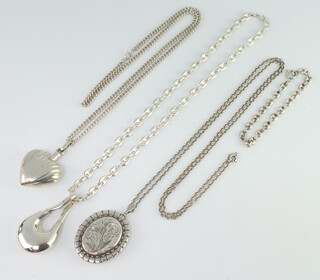 A silver locket and chain, 2 silver pendants and chains 114 grams
