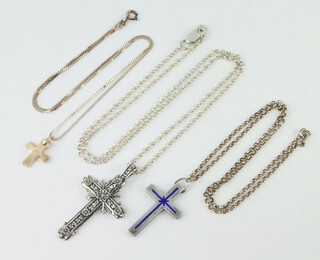 Three silver cross pendants and chains and a Canadian leaf ditto 30 grams 