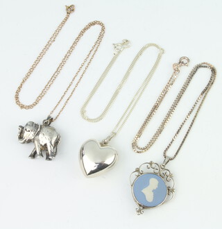 Three silver mounted hardstone pendants and chains, gross 24 grams