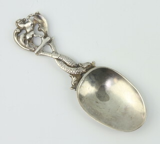 A Continental silver caddy spoon with entwined dolphin stem 24 grams