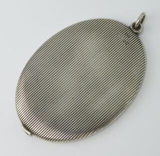 A Victorian silver engine turned oval mirror 9cm, marks rubbed