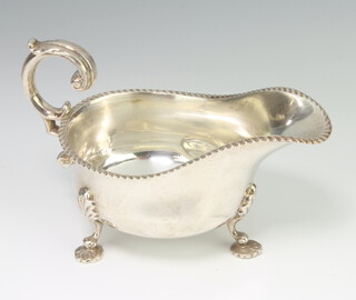 An Edwardian silver sauce boat with S scroll handle on shell feet Sheffield 1903, 230 grams 16cm 