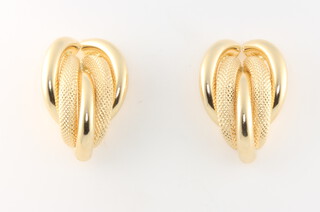 A pair of 18ct yellow gold scroll ear clips 5.6 grams 