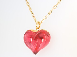 A Lalique twisted heart red glass pendant on an 18ct yellow gold chain 44cm, the chain 11 grams 