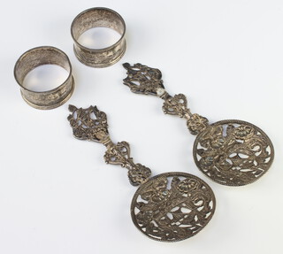 A pair of Victorian silver sifter spoons decorated with galleons, London 1898 together with 2 silver napkin rings 198 grams
