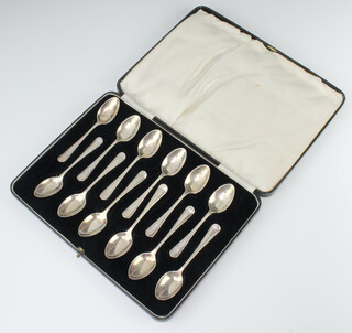 A set of 12 silver ribbon and bow coffee spoons cased, Sheffield 1934, 118 grams 