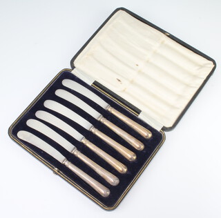 Six silver handled butter knives cased