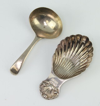 A silver caddy spoon with shell bowl and handle Birmingham 1972, a plain ditto London 1801, 34 grams 