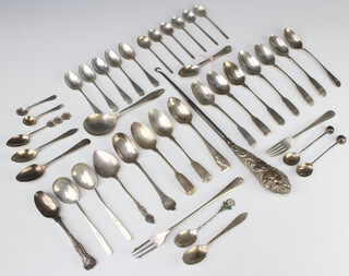 An Edwardian silver teaspoon Sheffield 1906 and a quantity of spoons and forks, 578 grams 