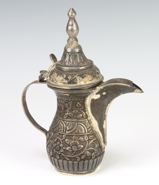 An Arabian white metal coffee pot with repousse decoration 260 grams, 17cm 