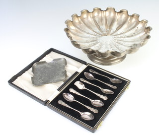 An Edwardian silver plated fluted fruit bowl 25cm, a cased set of plated coffee spoons together with an Art Nouveau pewter dish 