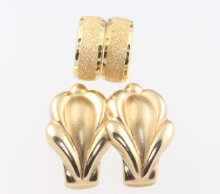 Two pairs of 9ct yellow gold ear clips, 3 grams