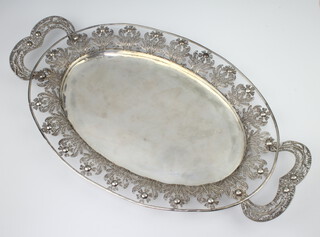 A Continental filigree white metal 2 handled tray with floral decoration 55cm, 1188 grams 