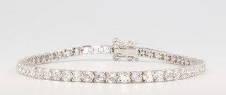 An 18ct white gold brilliant cut diamond line bracelet 6.12ct, 12.4grams, 19cm 