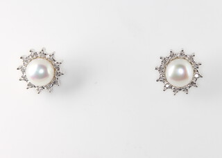 A pair of 9ct white gold cultured pearl and diamond cluster earrings 2.7 grams, 10mm 