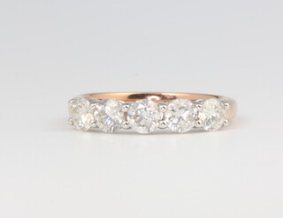 An 18ct rose gold 5 stone diamond ring approx. 1.3ct, size M 1/2, 3.6 grams together with a WGI certificate 