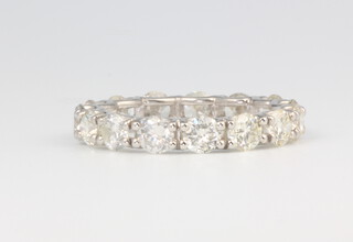 A platinum diamond eternity ring, the 15 brilliant cut stones 2.98ct, size L, 4.4 grams 