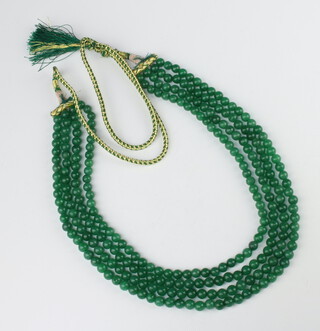 A 4 strand string of green hardstone beads, 48cm 