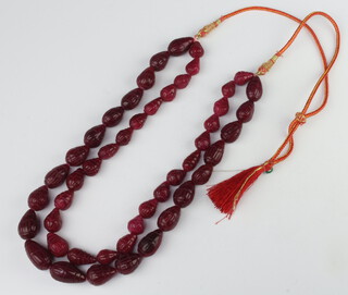 A double strand string or carved red hardstone beads 42cm 
