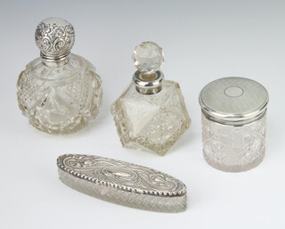 An Edwardian silver spherical scent bottle with repousse silver lid Chester 1907 11cm, a circular ditto 7cm, a square ditto 11cm and an oval box 13cm 