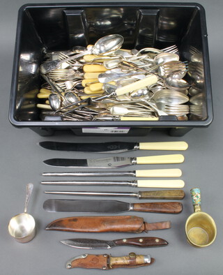 A quantity of silver plated cutlery including a carving set 