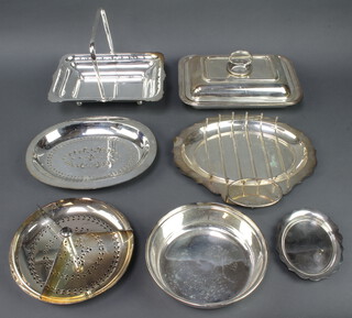 A silver plated entree dish, swing handled basket and minor plated wares