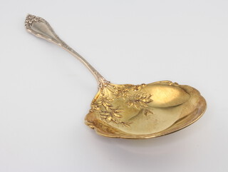 A sterling silver caddy spoon with gilt floral bowl 48 grams