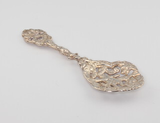 A Victorian cast silver sifter spoon decorated with figures Birmingham 1891 