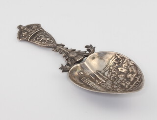An Edwardian silver caddy spoon decorated with a scene of Balmoral, Edinburgh 1909, maker Robb Ballater 17 grams 