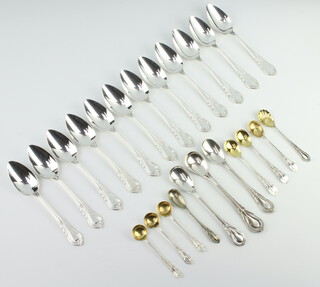 Twelve silver plated lily pattern tea spoons together with minor mustard and salt spoons