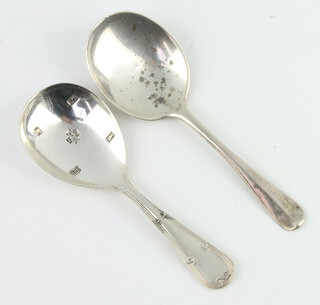 A silver caddy spoon, London 1931, engraved Cartier, 1 other 37 grams