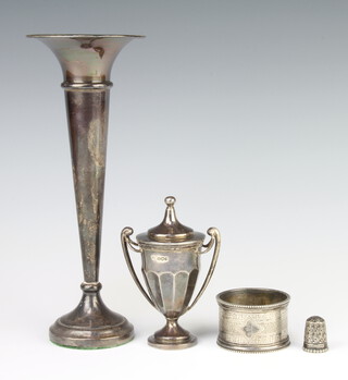 A tapered silver posy vase Birmingham 1975 20cm, a 2 handled trophy cup and cover, napkin ring and thimble, weighable silver 136 grams