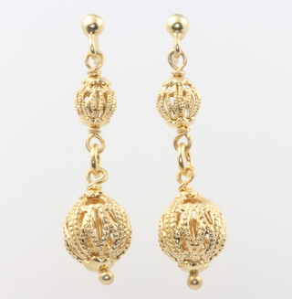 A pair of silver gilt earrings 3 grams and a pair of 9ct yellow gold earrings 2.7 grams 