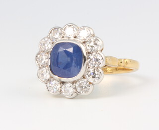 An 18ct yellow gold sapphire and diamond cluster ring, the centre stone approx. 2.2ct surrounded by brilliant cut diamonds 1ct, size N 1.2, 5.5 grams 