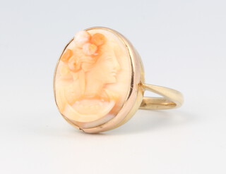 A 9ct yellow gold carved coral portrait ring, size K 1/2, 4.5 grams 