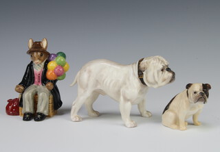 A Royal Doulton figure of a bulldog HN1074 8cm, ditto seated bulldog K1 5cm and a ditto figure Balloon Man 9cm 