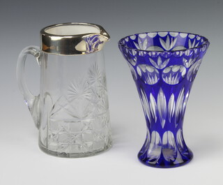 A cut glass jug with silver lip 19cm together with a blue flash glass Bohemian tapered vase 18cm 