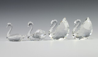 Two Swarovski Crystal figures of swans 9cm, ditto 7cm and another 6.5cm 