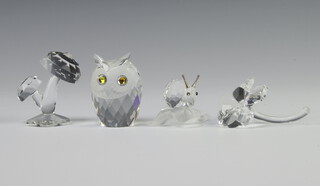 A Swarovski Crystal figure of toadstools 5cm, ditto owl 5cm, snail on a leaf 3cm and a flower 3cm  
