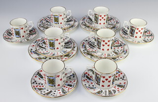 A Staffordshire Elizabethan pattern coffee set comprising 8 coffee cups, 8 saucers and 4 plates decorated with playing cards 