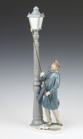 A Lladro figure of a lamp lighter 5205 47cm 
