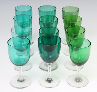 A harlequin set of 8 green wine glasses and 4 others