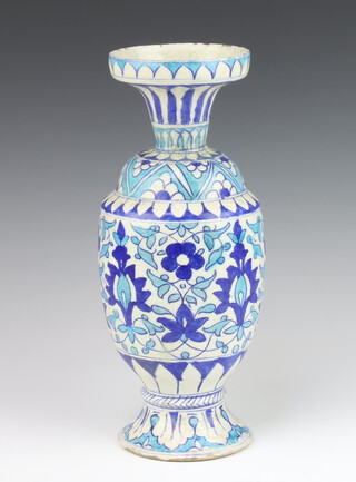 An Isnic style oviform vase with flared neck decorated with formal flowers 32cm 